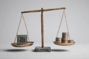 A CPU balancing perfectly with a stack of coins answering is Ryzen 5 5600X good for gaming