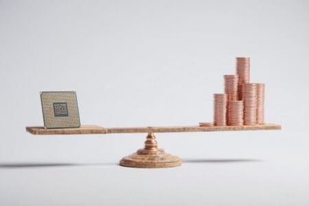 A CPU balancing with a small stack of money illustrating why Ryzen 5 is good for gaming