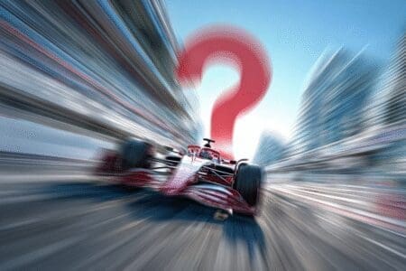 A race car with heavy motion blur and a question mark asking does motion blur increase FPS